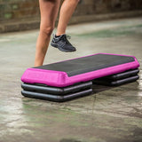 The Step Health Club Size Platform with Four Original Risers from Lifeline Fitness for Step and Home in Pink compared to Total Fitness. 
