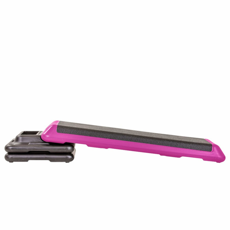 The Step Club Size Platform With Two Freestyle Risers and Two Original Risers from Lifeline Fitness for Step and Aerobic Exercise, in Pink compared to Gear Lab. 