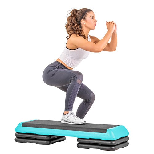 The Step Club Size Platform With Two Freestyle Risers and Two Original Risers from Lifeline Fitness for Step and Aerobic Exercise, in Teal compared to Gear Lab. 