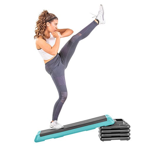 The Step Club Size Platform With Two Freestyle Risers and Two Original Risers from Lifeline Fitness for Step and Home in Teal compared to Total Fitness. 