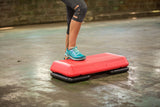 The Step Circuit Size Platform with Two Freestyle Risers from Lifeline Fitness for Step and Home in Red compared to Total Fitness. 