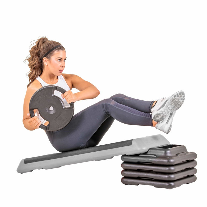 The Step Club Size Platform With Two Freestyle Risers and Two Original Risers from Lifeline Fitness for High Step and Home, in Grey compared to Elivate Fitness. 